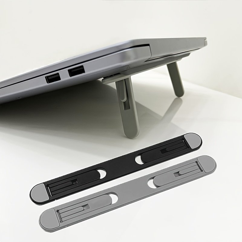 2cb7994a-04bf-40e0-91e1-961b78772ab9.jpg Adjustable Foldable Laptop Stand Portable Ergonomic Notebook Holder